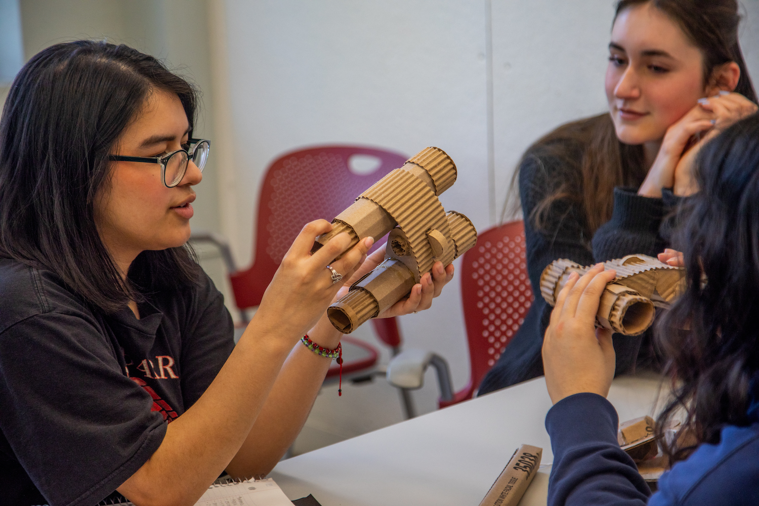 students sharing cardboard prototypes