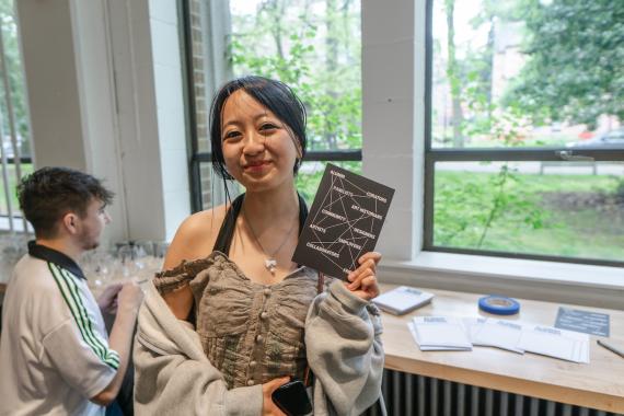 Alum with a postcard