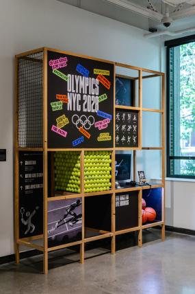 Exhibition view of wooden structure displaying students' work.