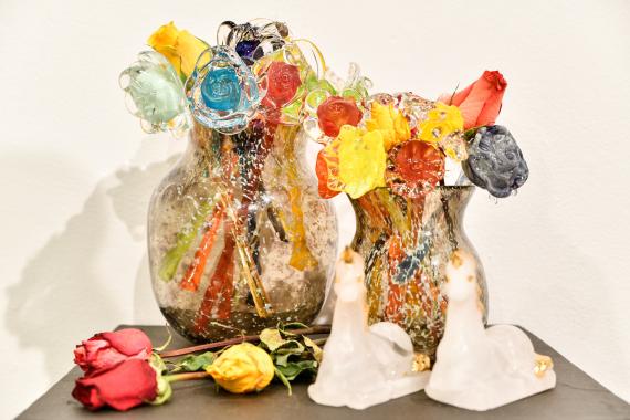 Close-up of student's glass work featuring flowers 