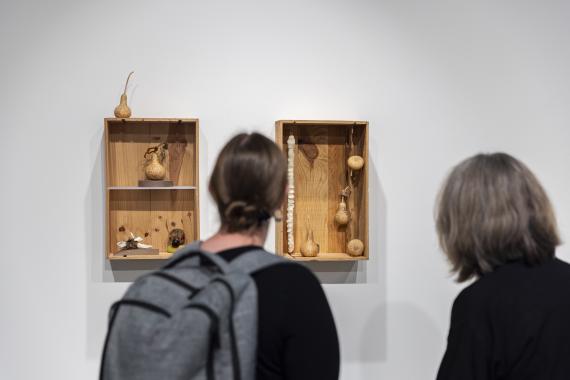 Visitors viewing Rob Rhee's exhibition, Crossings