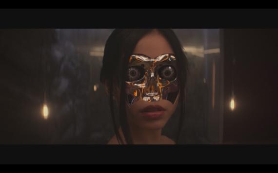 Photograph of a humanoid robot with face partially removed to expose robotics beneath.