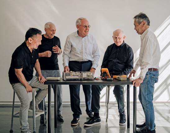 Icons of innovation, these industrial designers who trained at the UW enjoy a reunion in an Art Building workroom. From left: Steve Kaneko, Dell King, David Smith, George McCain and Harold Kawaguchi. KRIS LADERA