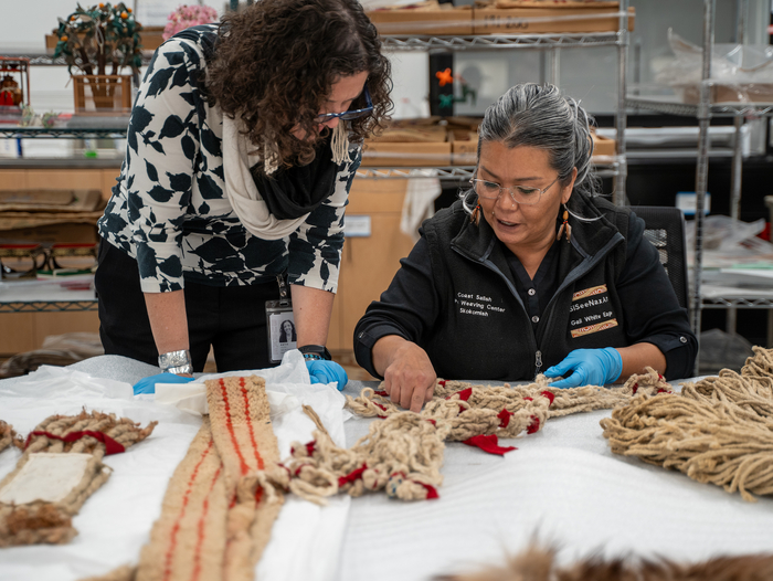 Kathryn Bunn-Marcuse and SiSeeNaxAlt Gail White Eagle (Muckleshoot weaver and co-curator)