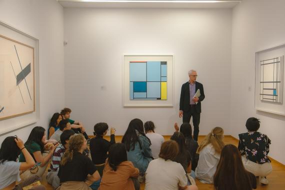 Associate Professor Marek Wieczorek and students in a museum