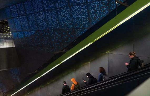 Public art by Leo Saul Berk above an escalator