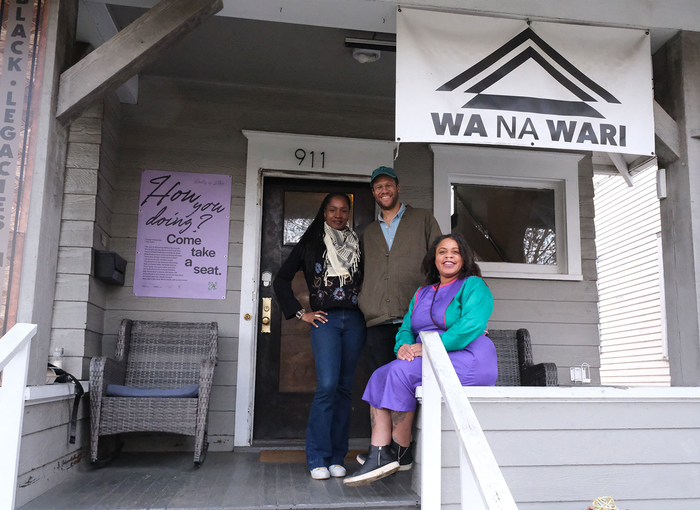 Berette S. Macaulay, Simon Benjamin, and Elisheba Johnson outside of Wa Na Wari