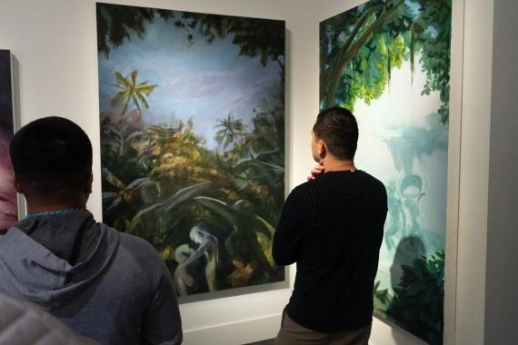 Visitors to Seattle’s Wing Luke Museum view Kyler Pahang’s “A Dance With Grief” and “A Cry for Uran,” part of the “Lost & Found: Searching for Home” exhibit. Courtesy Wing Luke Museum