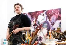 Victoria Mackender posing in her studio in Sand Point