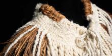 Mountain Protector, cape (detail), 2025. SiSeeNaxAlt Gail White Eagle (Muckleshoot). Yellow cedar and mountain goat wool.