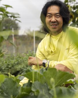Rob Rhee tending to his gourds at UW Farm