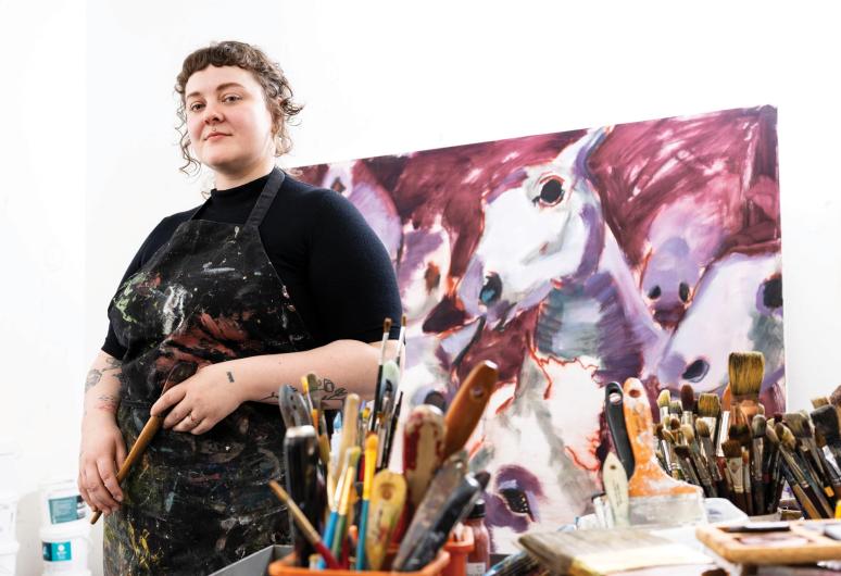 Victoria Mackender posing in her studio in Sand Point