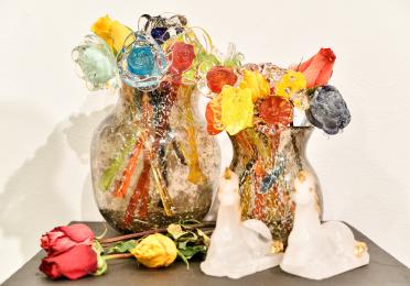 Close-up of student's glass work featuring flowers 