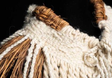 Mountain Protector, cape (detail), 2025. SiSeeNaxAlt Gail White Eagle (Muckleshoot). Yellow cedar and mountain goat wool.