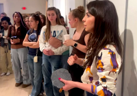 Christie Tirado explaining the process of creating relief block prints to students.
