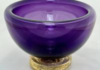 purple bowl made of blown glass, with a gold-flecked base