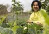 Rob Rhee tending to his gourds at UW Farm