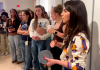 Christie Tirado explaining the process of creating relief block prints to students.