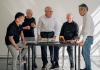 Icons of innovation, these industrial designers who trained at the UW enjoy a reunion in an Art Building workroom. From left: Steve Kaneko, Dell King, David Smith, George McCain and Harold Kawaguchi. KRIS LADERA