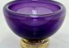 purple bowl made of blown glass, with a gold-flecked base