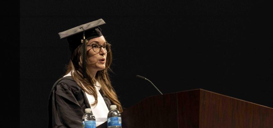 Lisa Bambach on the podium saying a speech