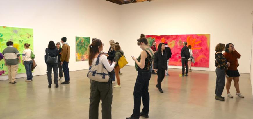 Art students and faculty viewing work in a gallery in Los Angeles
