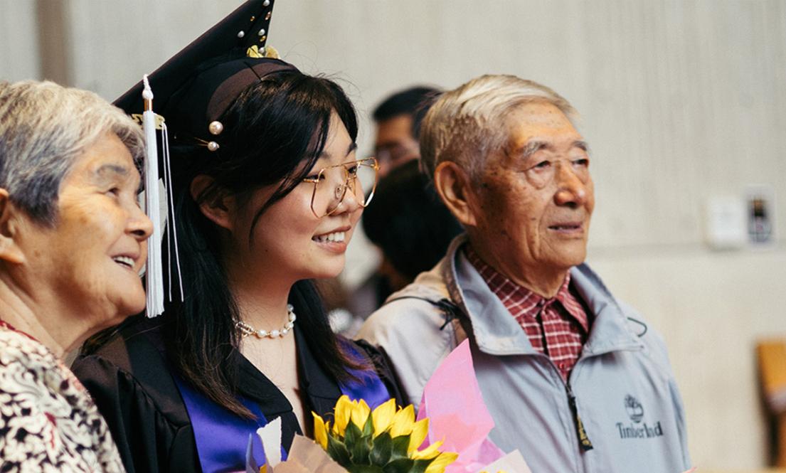 Student with family at the graduation celebration
