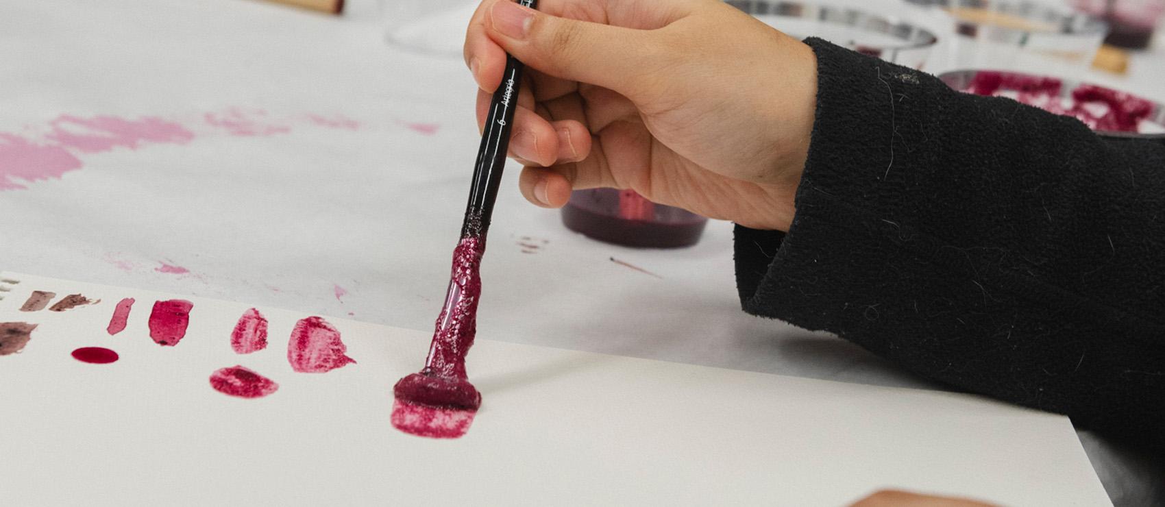 Students creating ink during a workshop