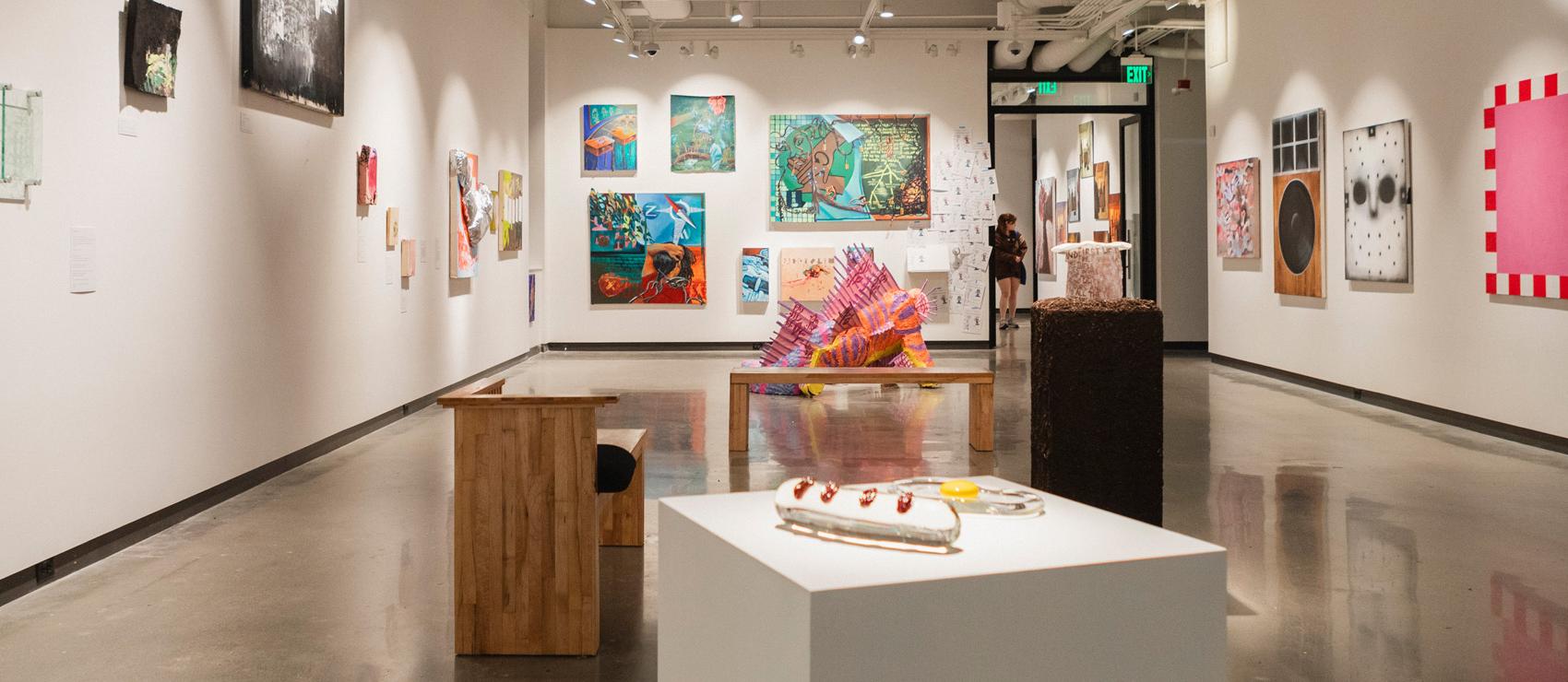 Installation view of Dispersal Patterns: Honors BA Grad Exhibition in the Jacob Lawrence Gallery.