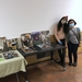 Evalynn Romano and her mother Evalina Romano next to tables with photographs