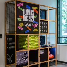 Exhibition view of wooden structure displaying students' work.