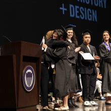 Graduate accepting diploma on the stage
