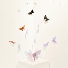 Close-up of student's glass work shaped as butterflies