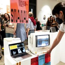 Visitor interacting with student's work