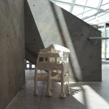 Close-up of sculpture in a concrete room