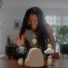 Person waving to characters from Todo project