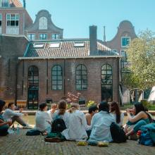 Students eating next to a canal