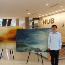 Kewei Zhu with paintings that won the 2016 HUB Director's Award