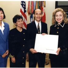 Ron Chew and others receiving IMS award from Hilary Clinton