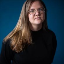 Portrait of Ruth Kazmerzak in a black mock neck shirt