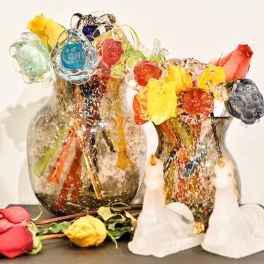 Close-up of student's glass work featuring flowers 