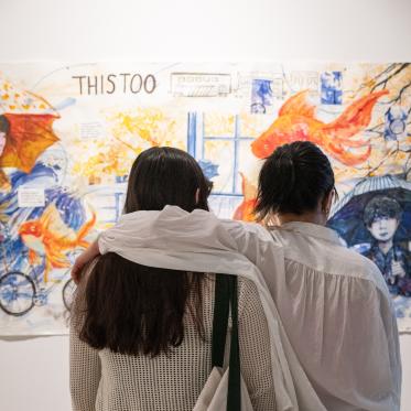 Gallery visitors looking at work in the 2026 BA in Art Graduation Exhibition Group 1
