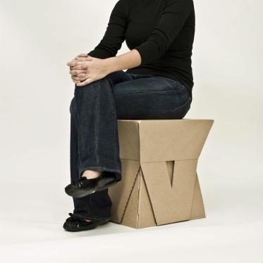 Student sitting on constructed stool 