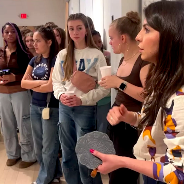 Christie Tirado explaining the process of creating relief block prints to students.