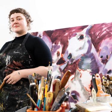 Victoria Mackender posing in her studio in Sand Point