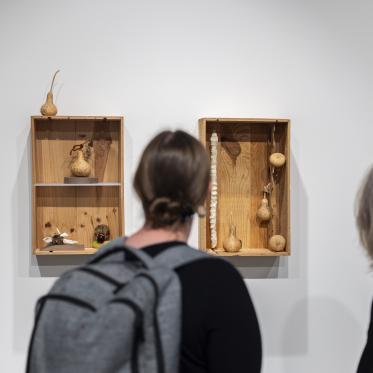 Visitors viewing Rob Rhee's exhibition, Crossings