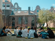 Students eating next to a canal