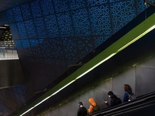 Public art by Leo Saul Berk above an escalator