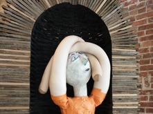 Fabric figure in wood arch by Claire Cowie and Leo Berk